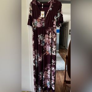 Full length short sleeve purple floral dress.